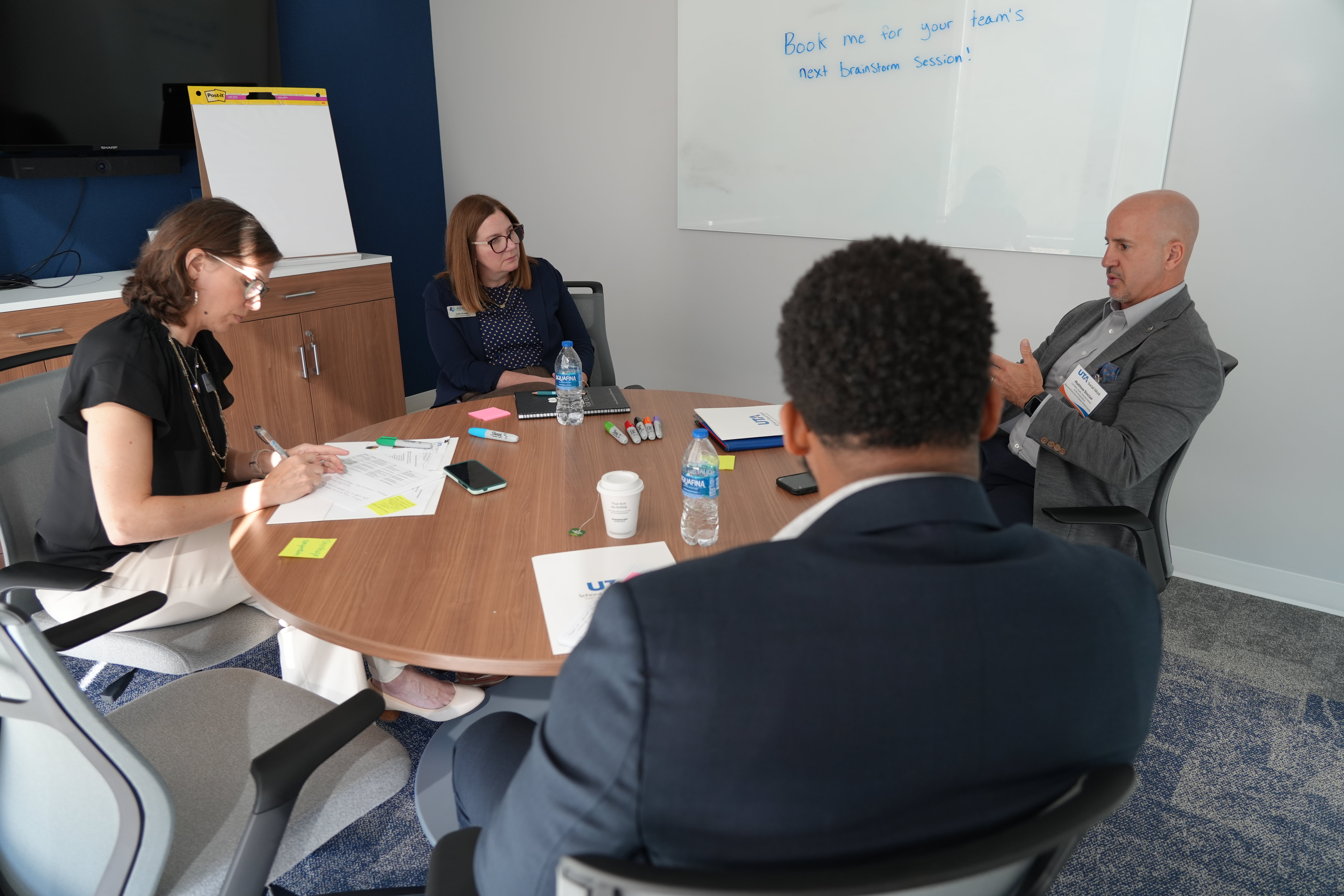 A small group discusses possible solutions to issues facing their communities at the “Reimagining Together: Strengthening Fort Worth’s Nonprofit Future” event. (Photo by Jaelon Jackson)  