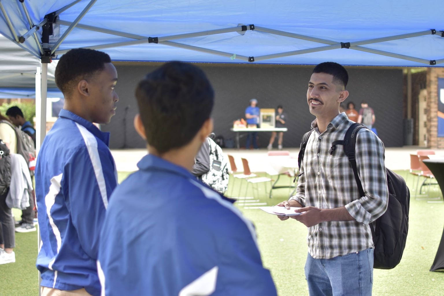 Student at an information booth