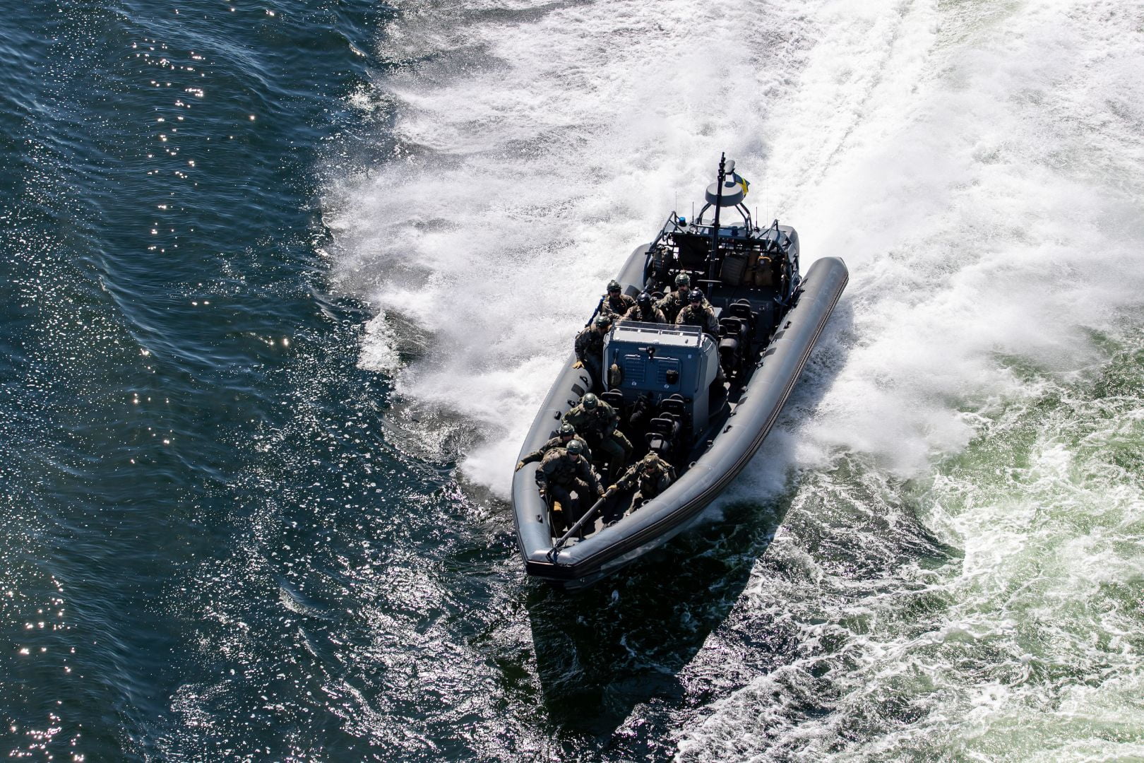 Image shows a small boat transporting soldiers" style=" height:1080px; width:1620px" _languageinserted="true" src="https://cdn.prod.web.uta.edu/-/media/4441c64e5bac4fb3b298280727c4c238.jpg