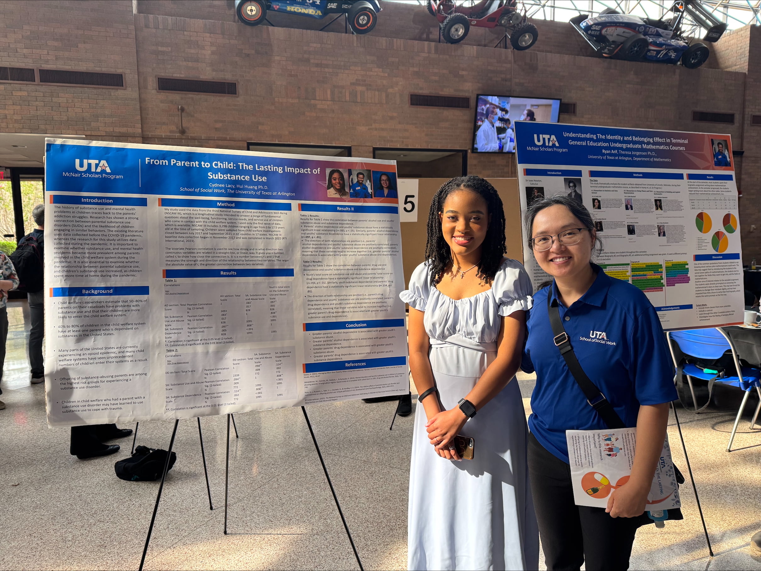 Cydnee Lacy, UTA School of Social Work BSW student (left), and Dr. Hui Huang, an associate professor in the UTA School of Social Work, pose for a photo at the 2025 JUTA McNair Symposium. (Photo by Cydnee Lacy)
