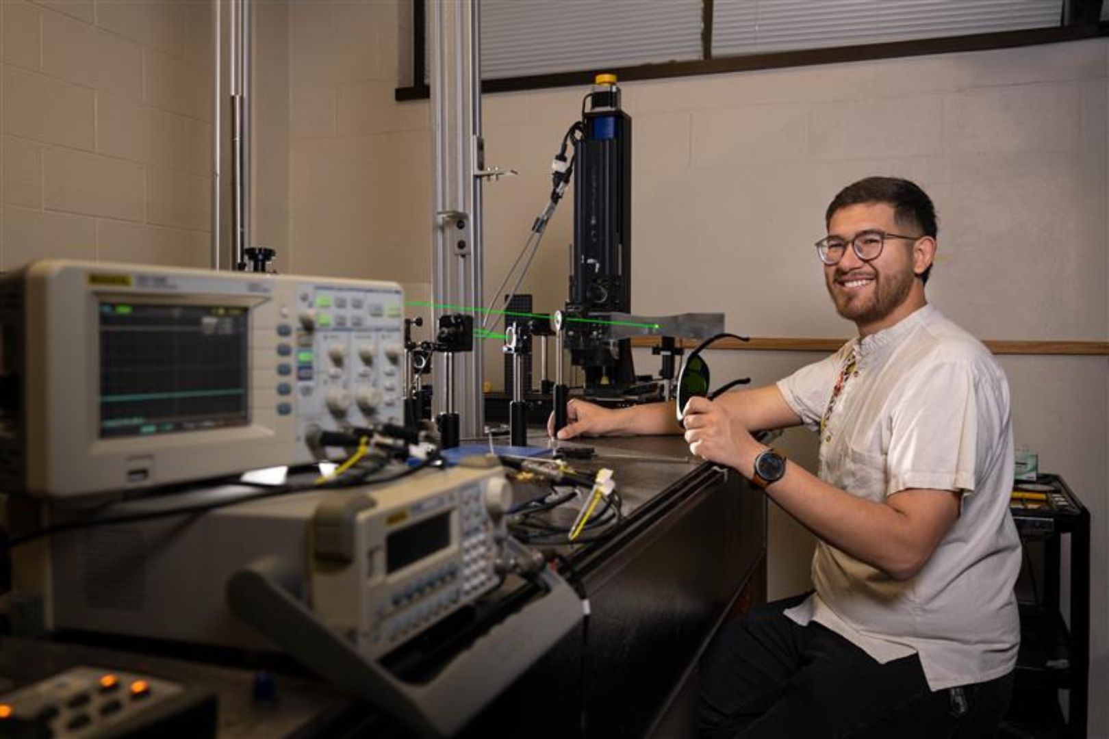Image shows photo of David Reynoso in a UTA lab