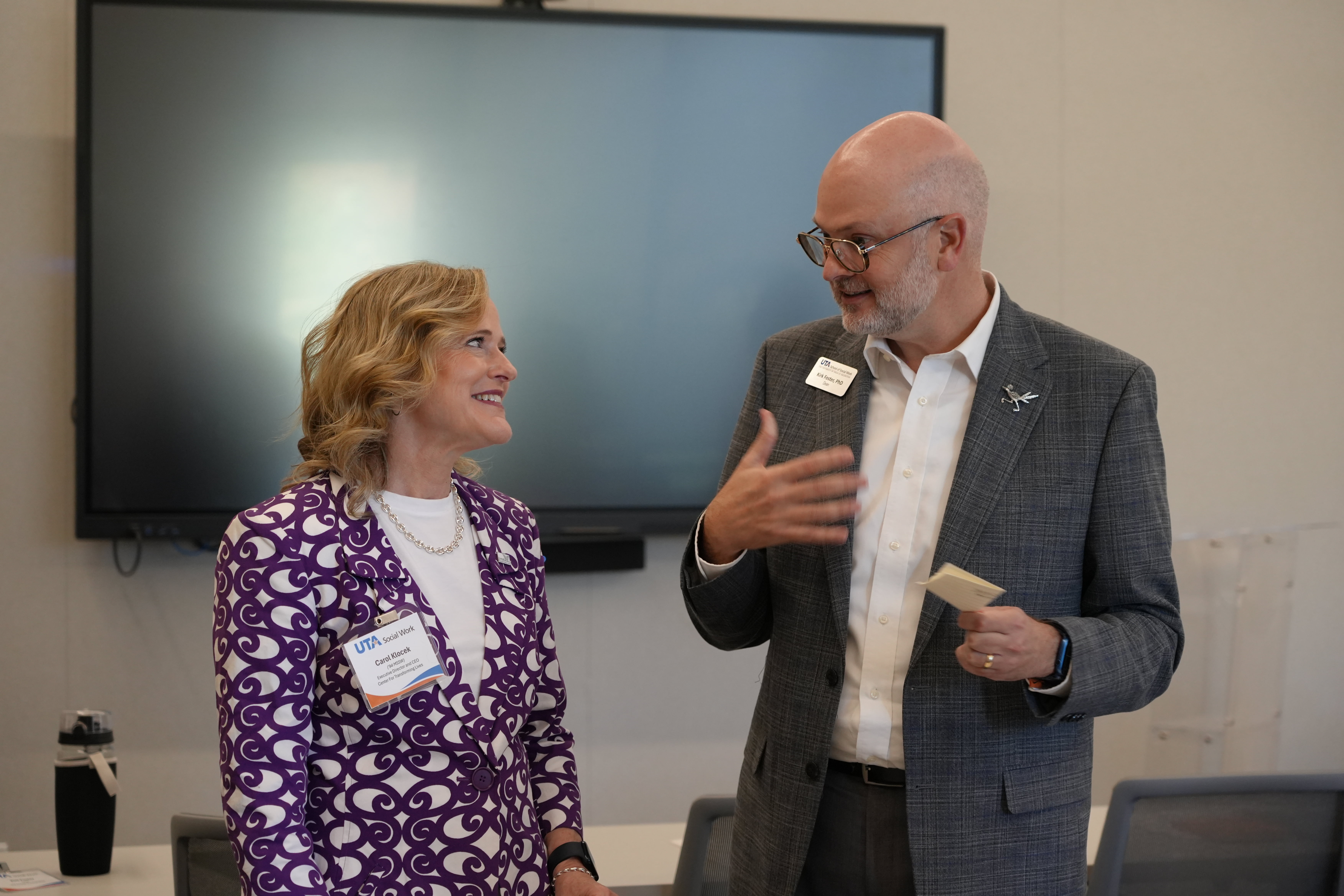 Carol Klocek, CEO of the Center for Transforming Lives, and Kirk Foster, Dean of the UTA School of Social Work, speak during the “Reimagining Together: Strengthening Fort Worth’s Nonprofit Future” event. (Photo by Jaelon Jackson) 