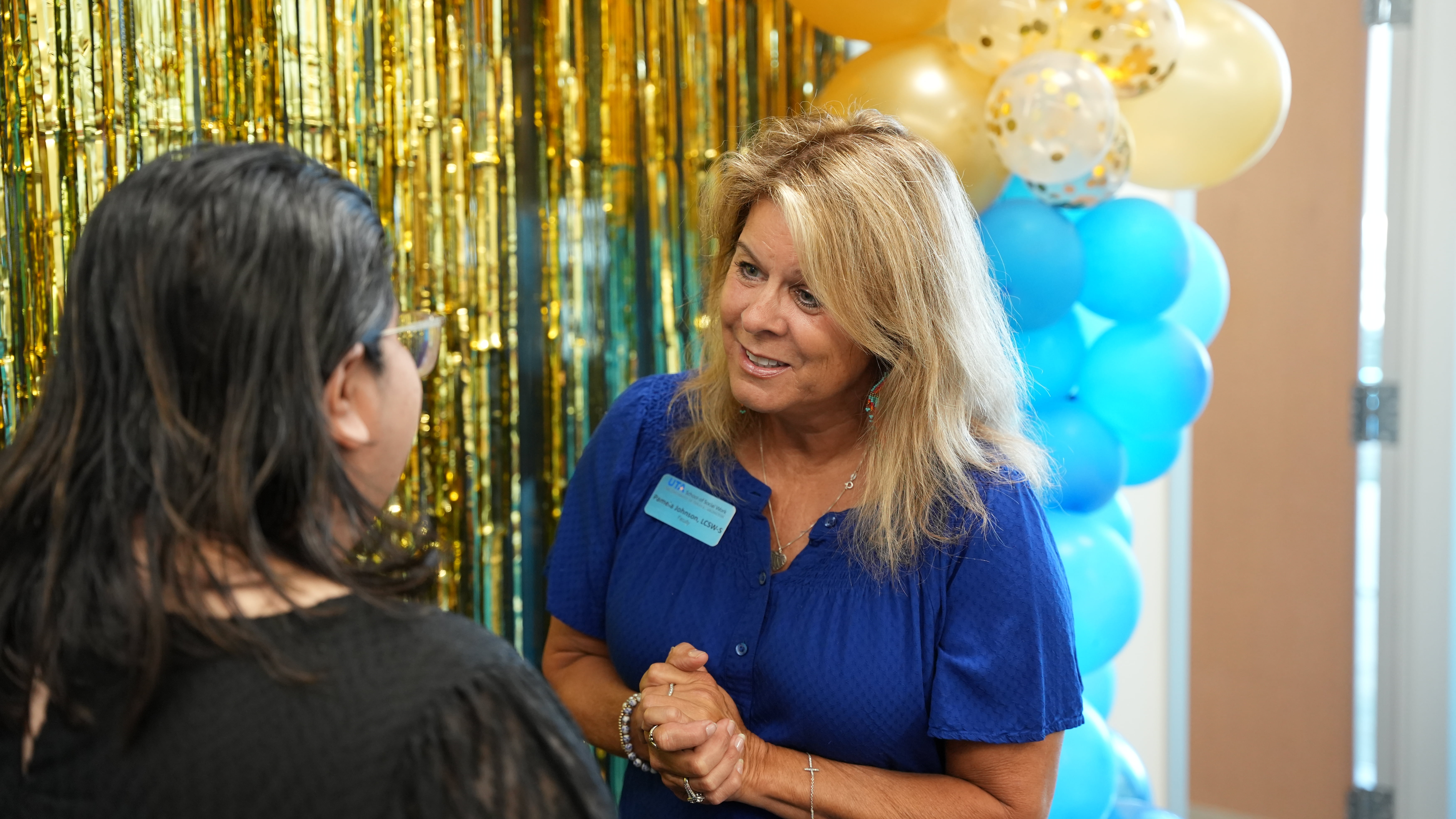Professor of Practice, Pamela Johnson, speaks with members of the UTA School of Faculty during her retirement ceremony. (Photo by Doughlas Gutierrez)