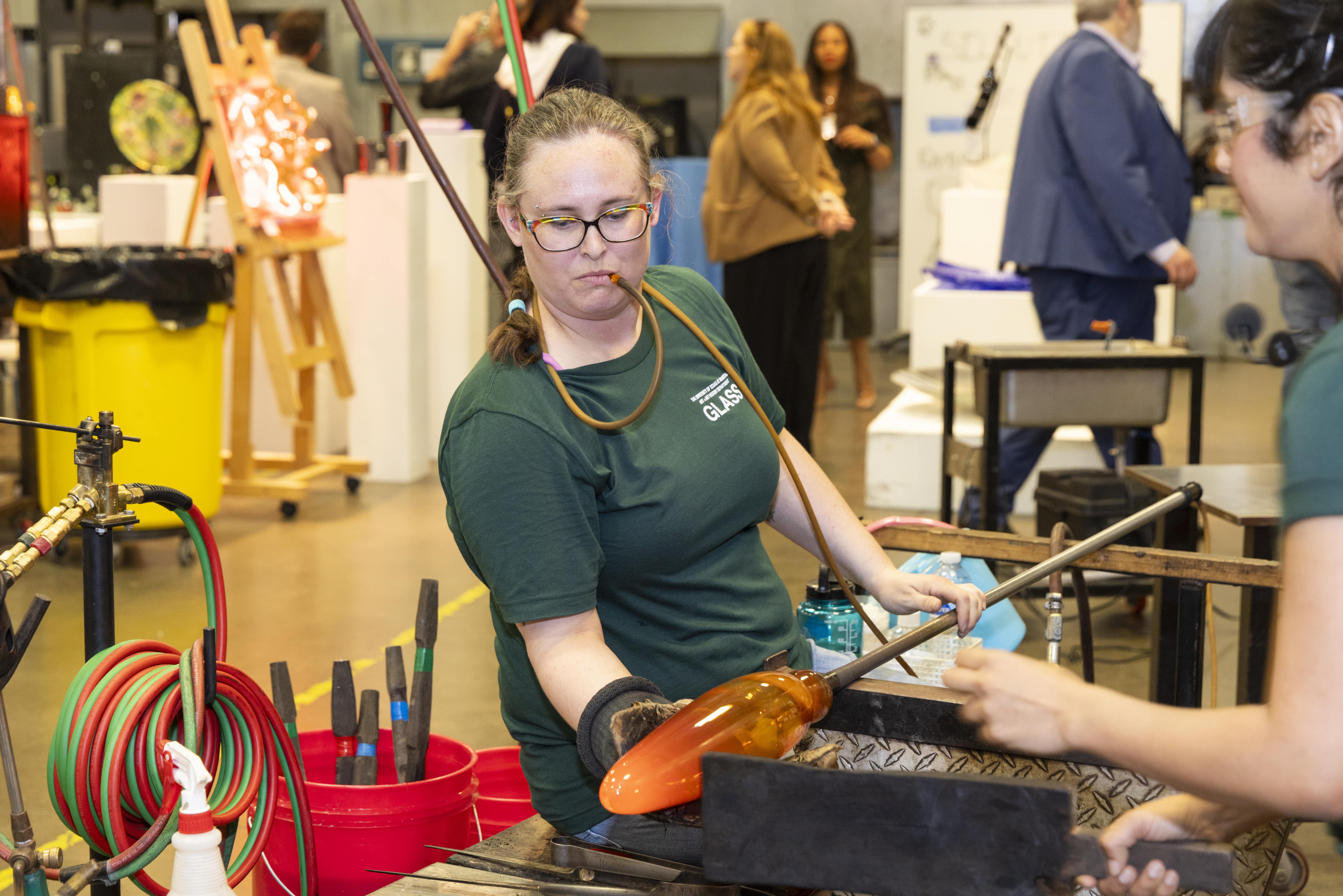 Amy Stephens leads glass blowing demonstration at U T A G 