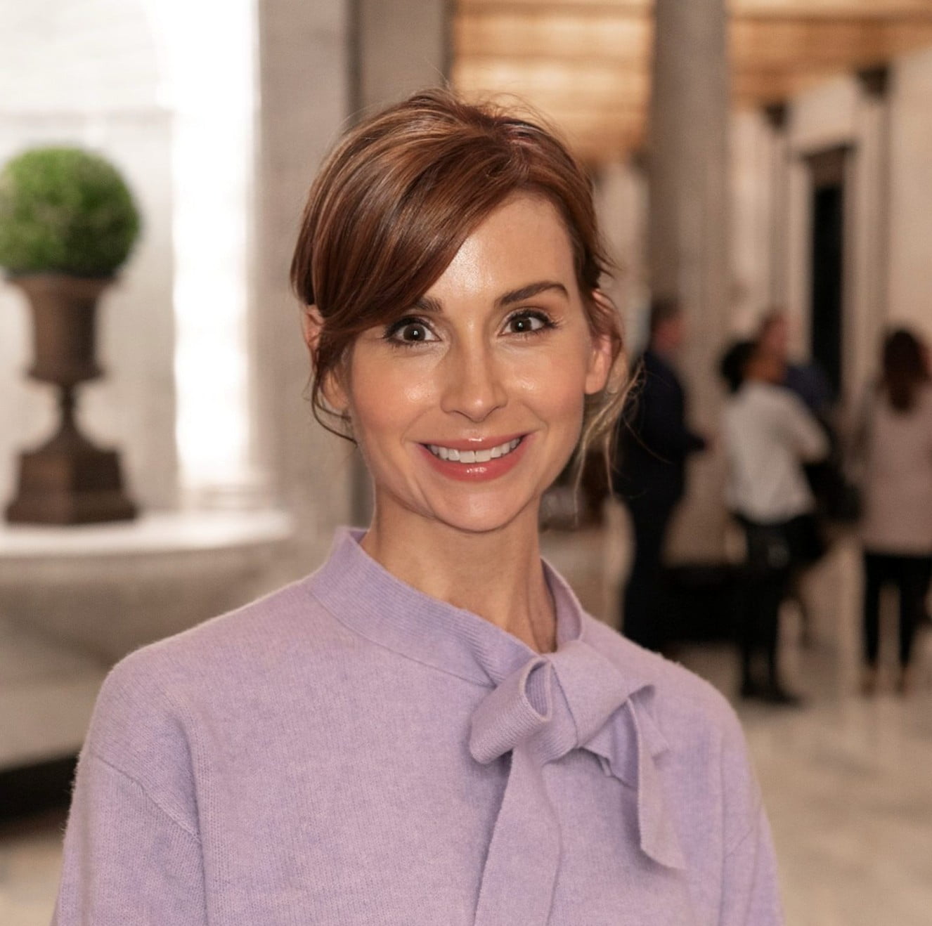 Dr. Andrea Germany, an Assistant Professor of Practice at the School of Social Work, poses for a photo in a lavender shirt.