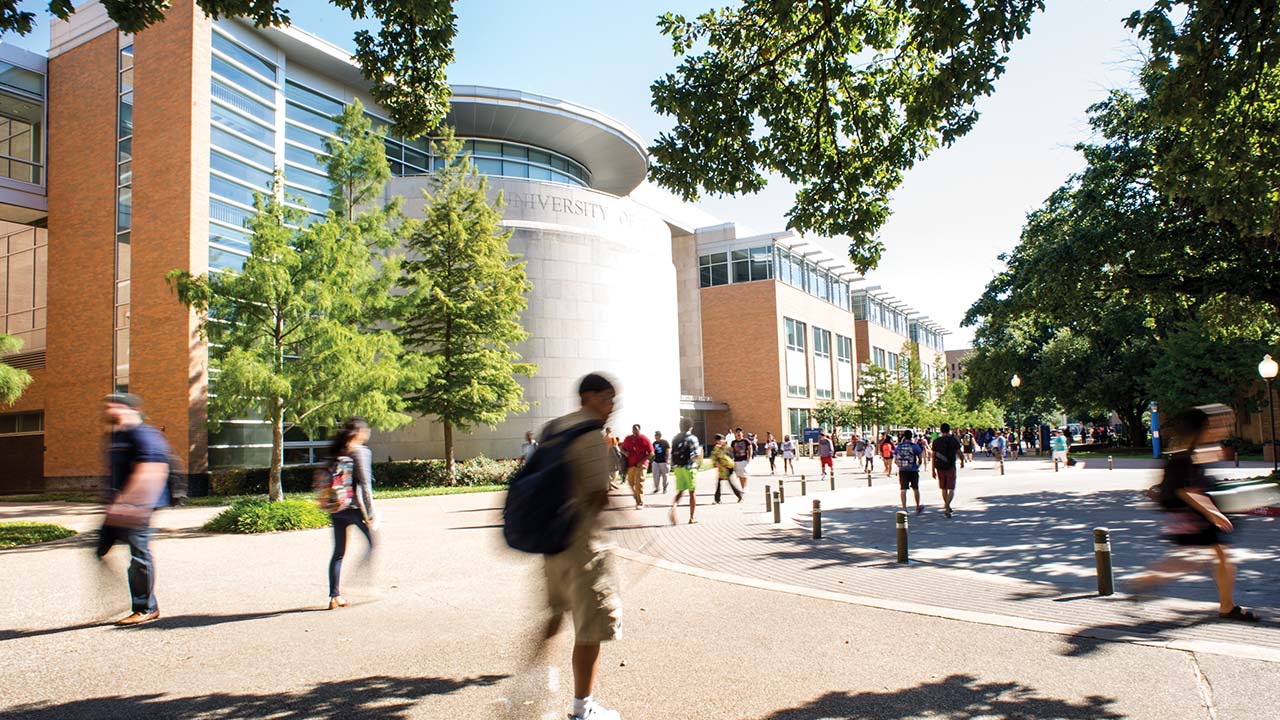 Students walking in front of the Planetarium