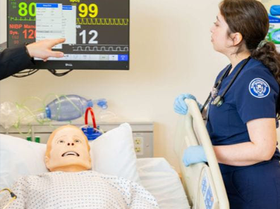 nursing student inside uta's smart hospital building