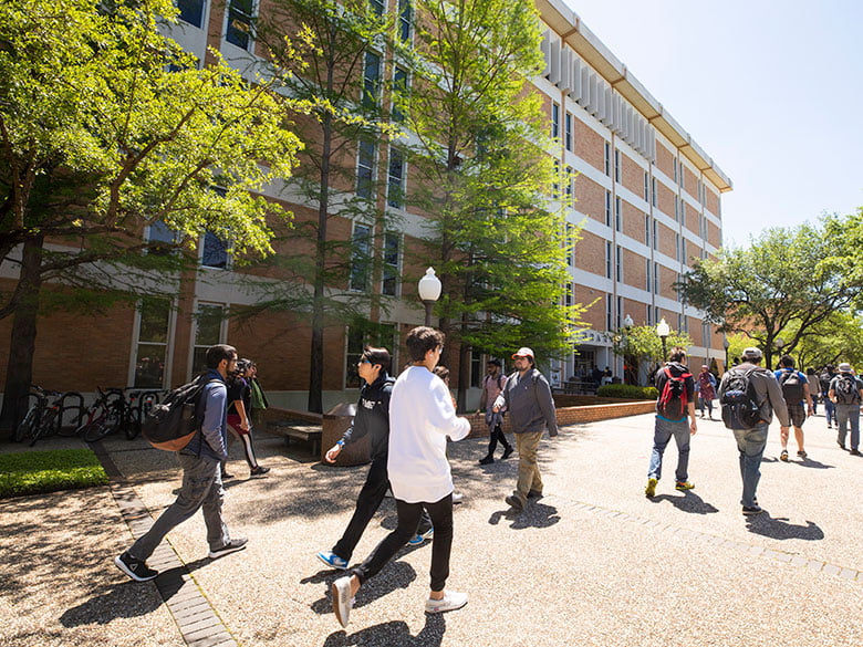 library exterior students walking