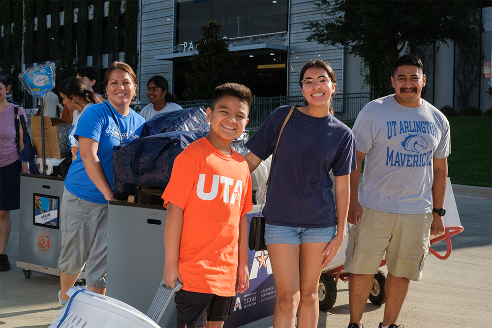 A family moving into the dorms at U T A 
