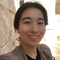 headshot of Dr. Hyesun Jeong, wearing a blazer over a dark shirt