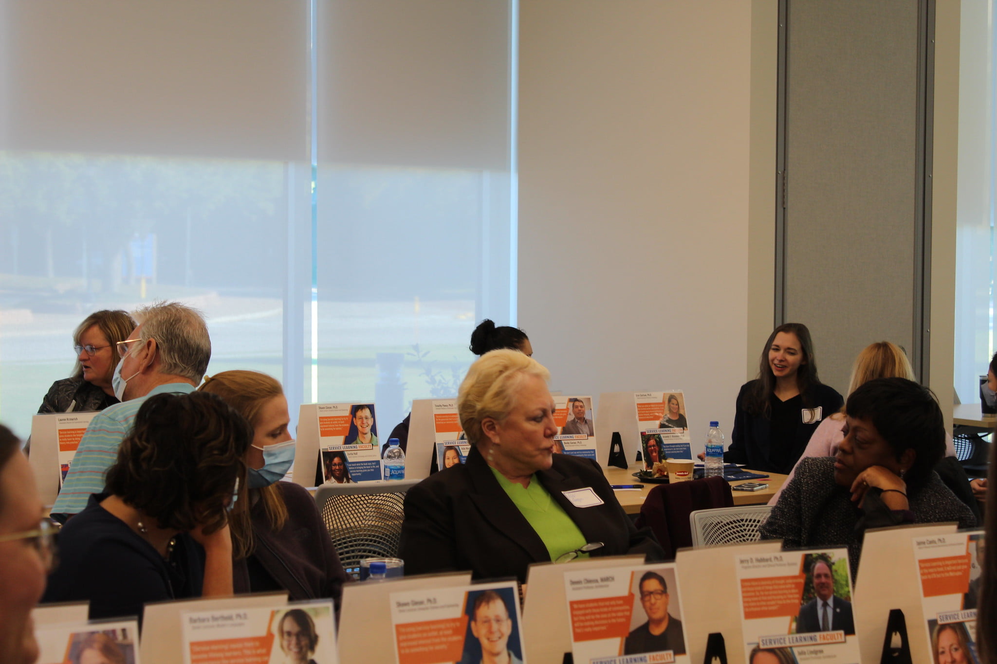 three faculty/staff talking to each other 