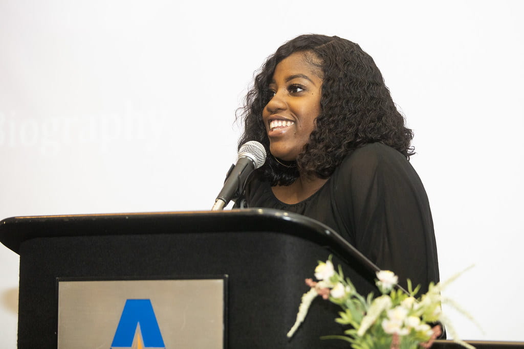 lady giving a presentation at a U T A event