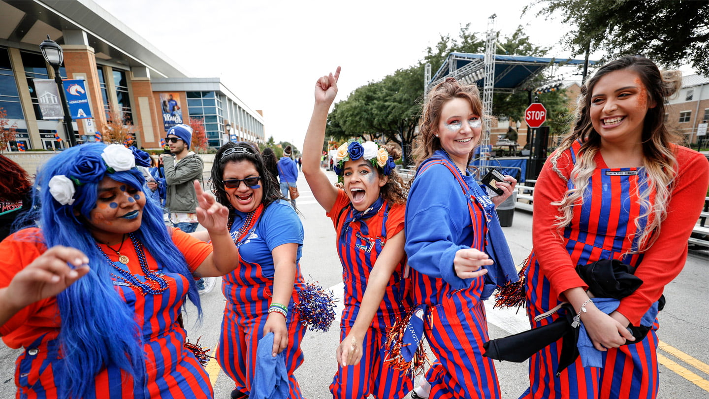 Student group cheering at homecoming festivities