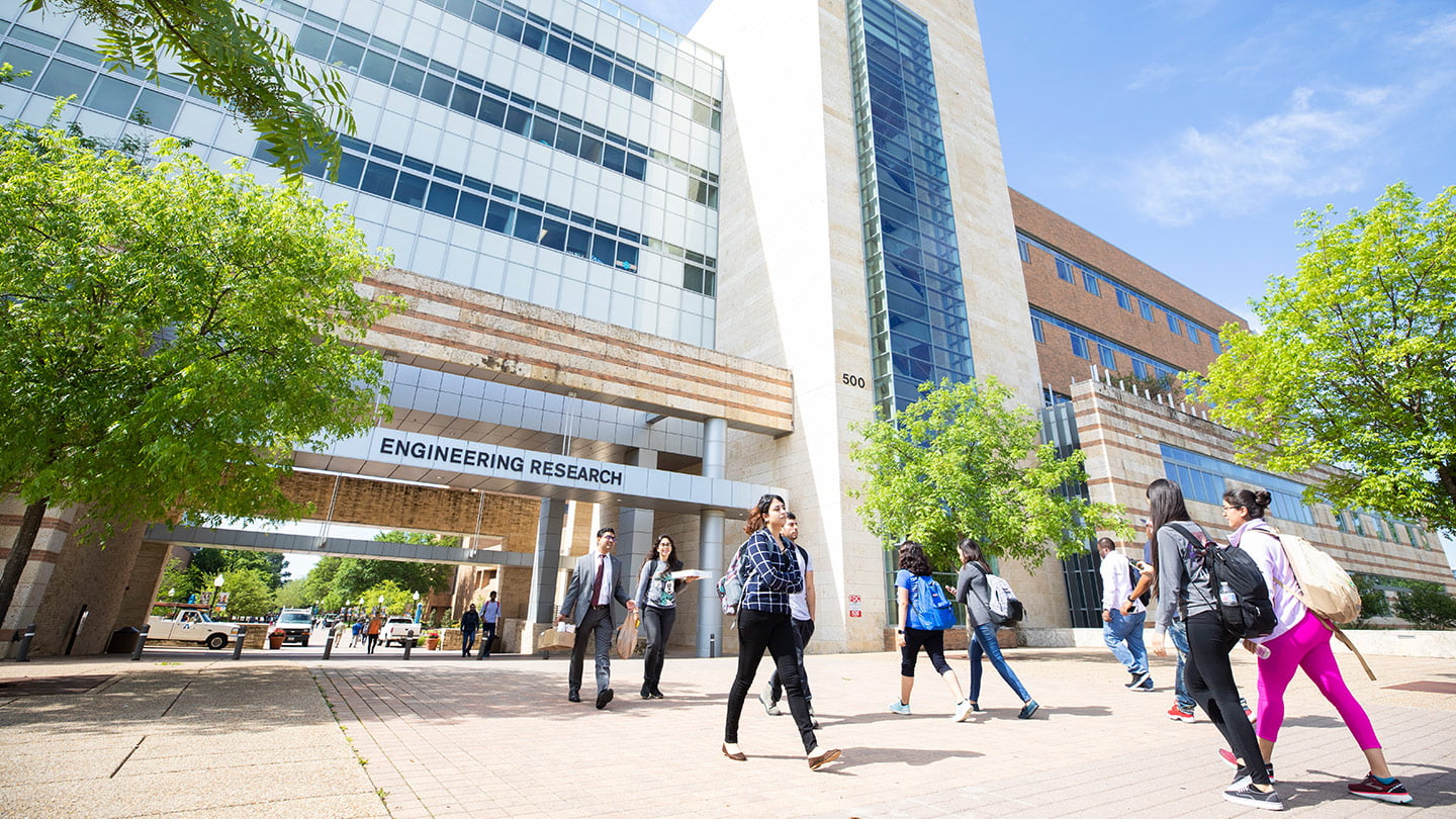 Students walking in front of the engineering research building