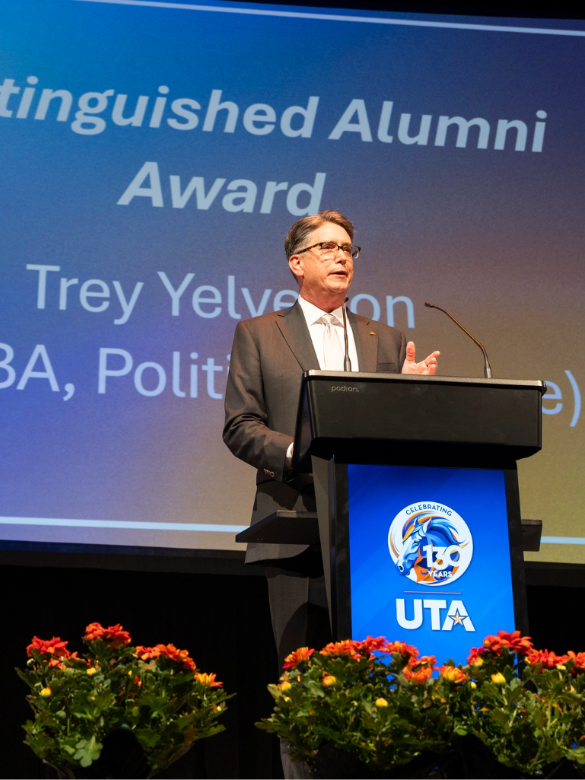 Trey Yelverton on stage at the Distinguished Alumni Awards 2025