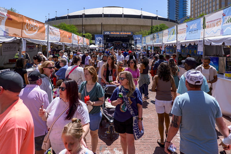 Jazz Brunch crowd featuring large crowd, vendors, and a UTA main stage in the background