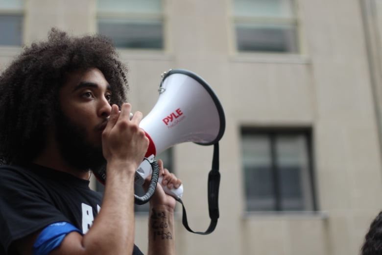 Person Holding Megaphone