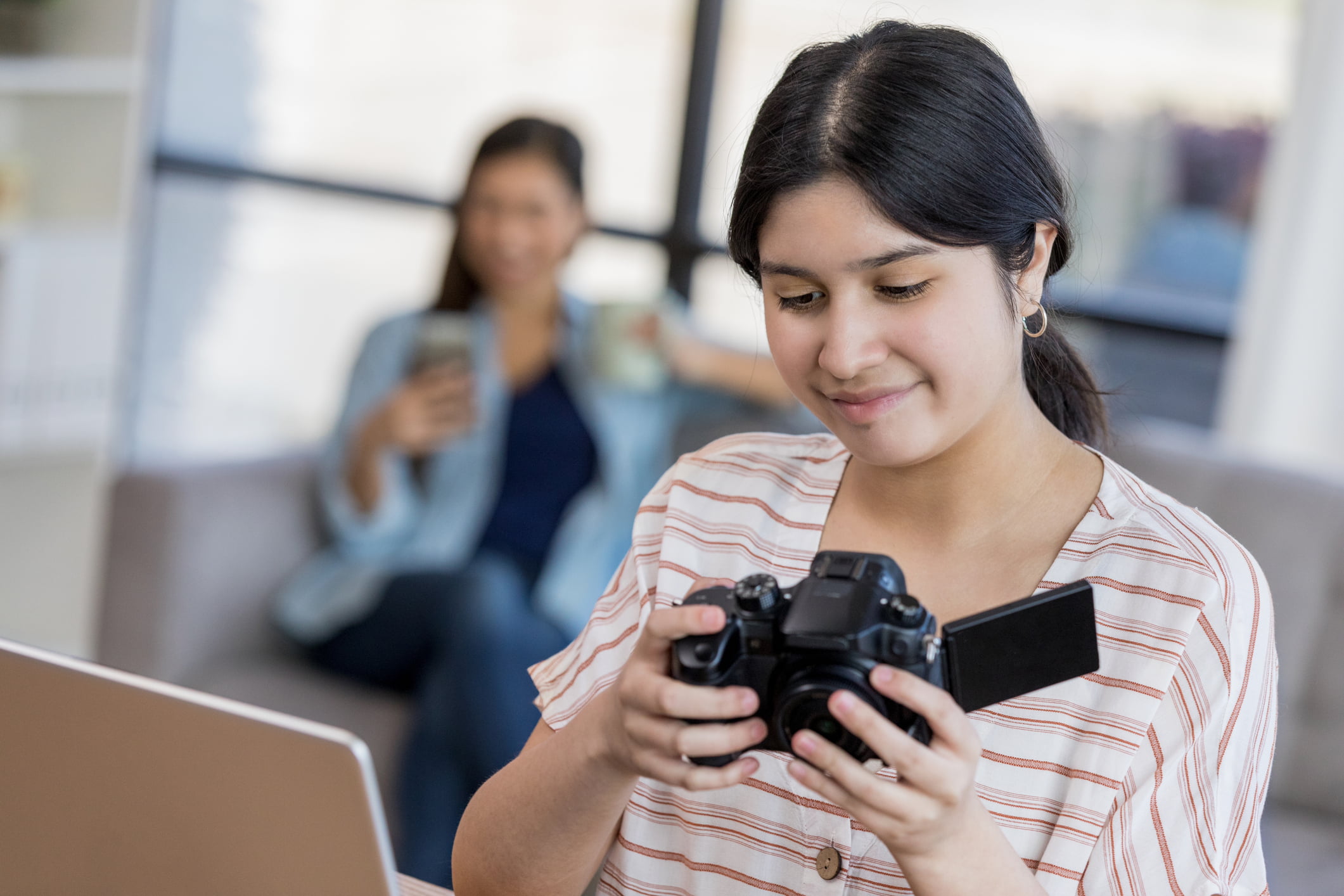 Girl handling video camera