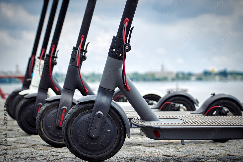 Electric scooters lined up together