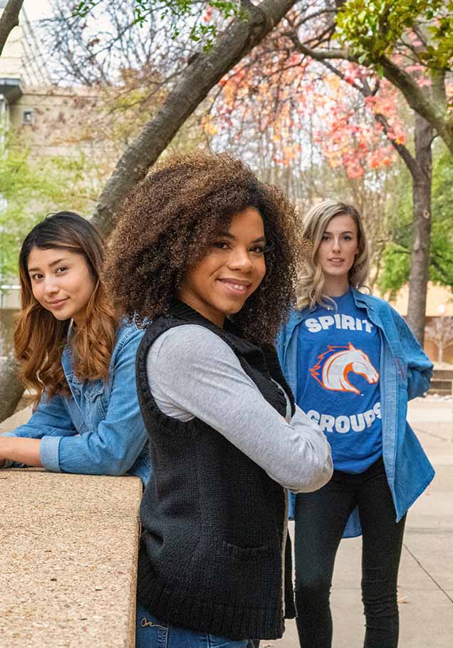 three students standing