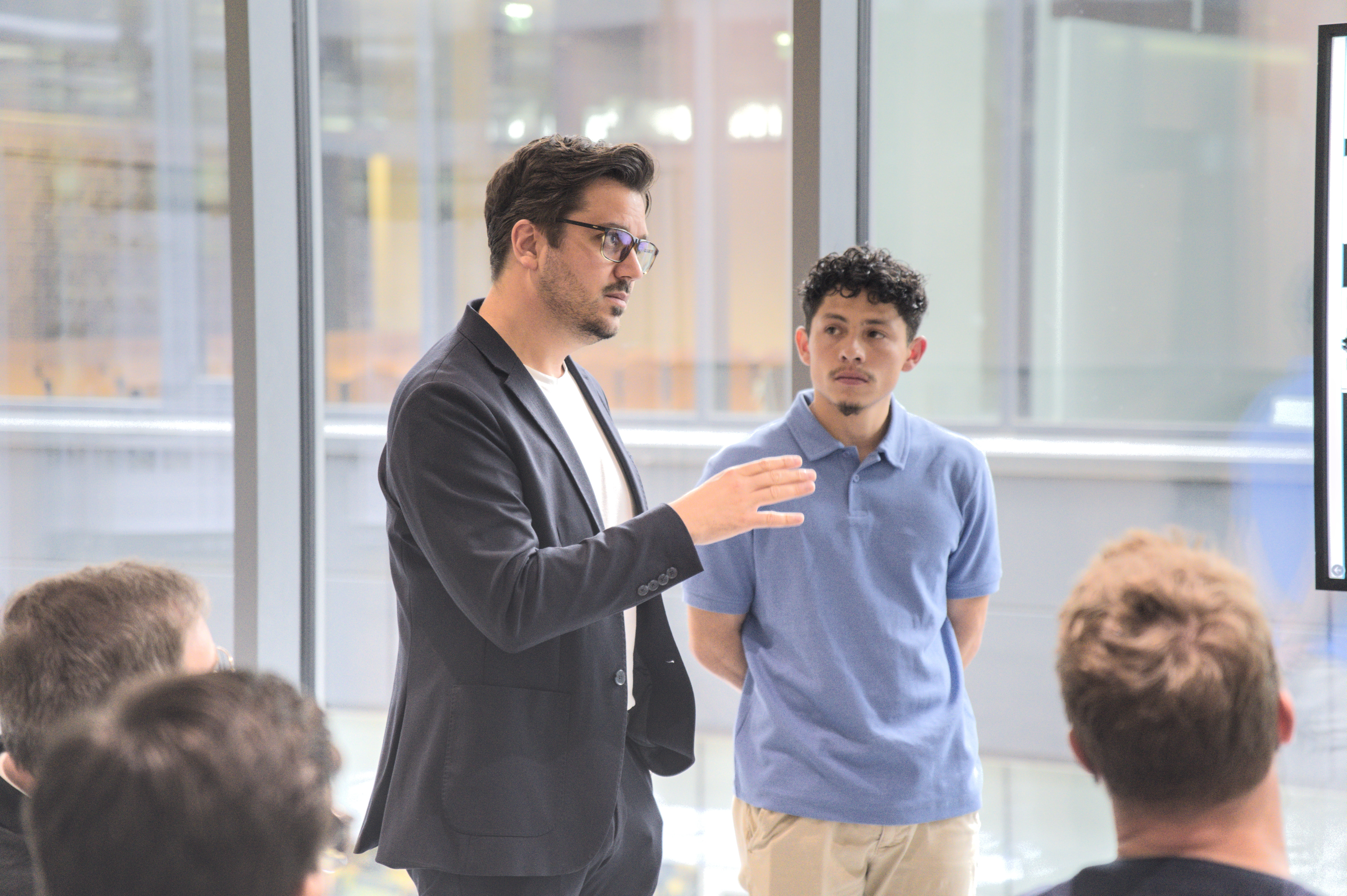 Dr. Oswald speaking with students