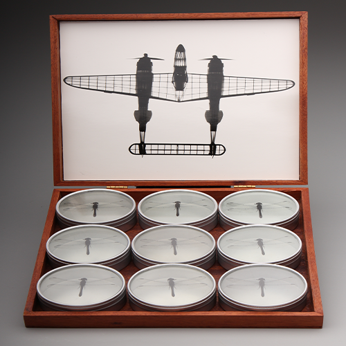 A photo of a box of candles with an photo of an airplane