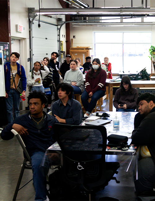 Photo of students intensely listening to a lecturer