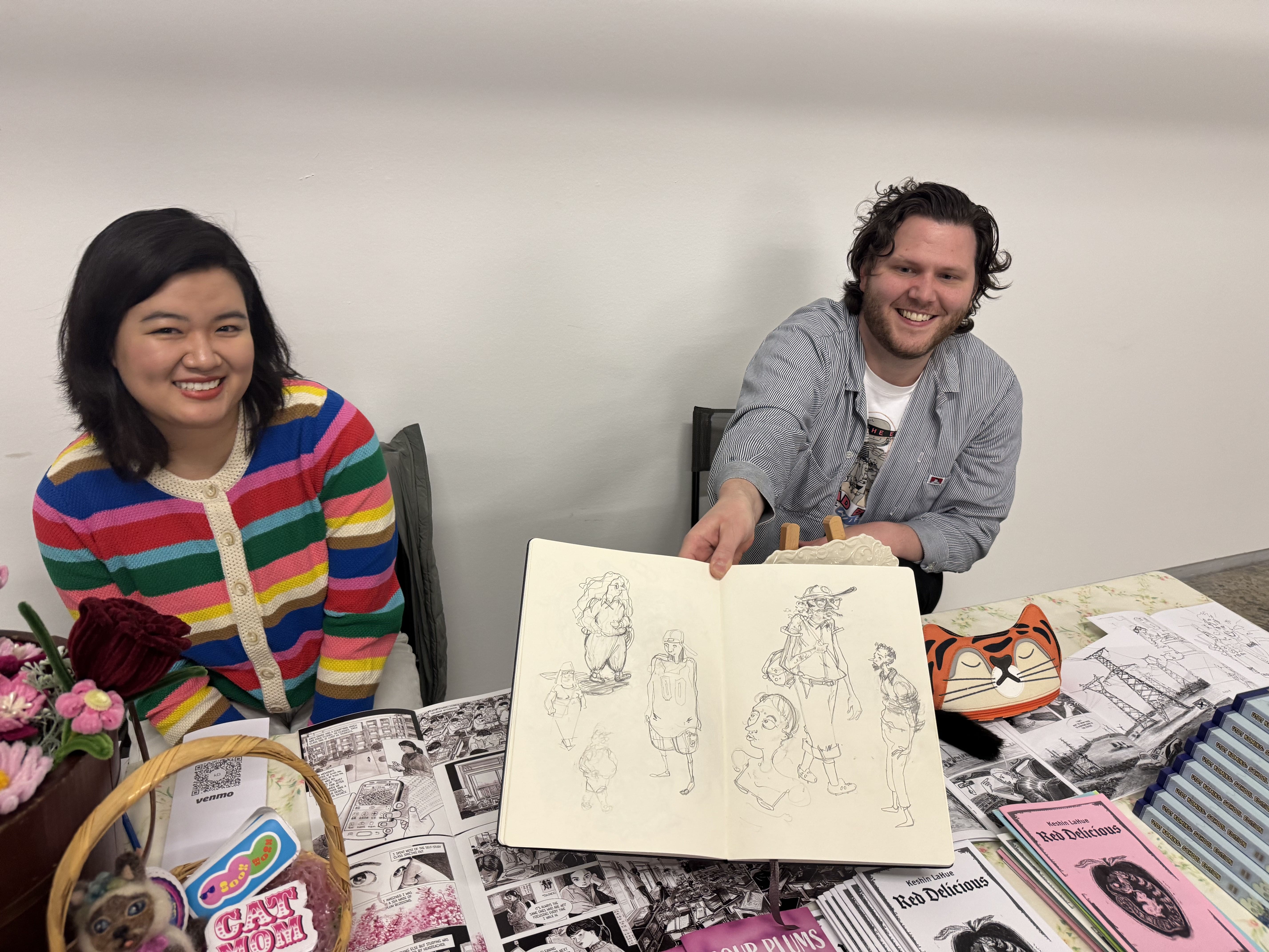 Keshin Ding and Mason LaHue D C BOOK FAIR DAY showing art piece