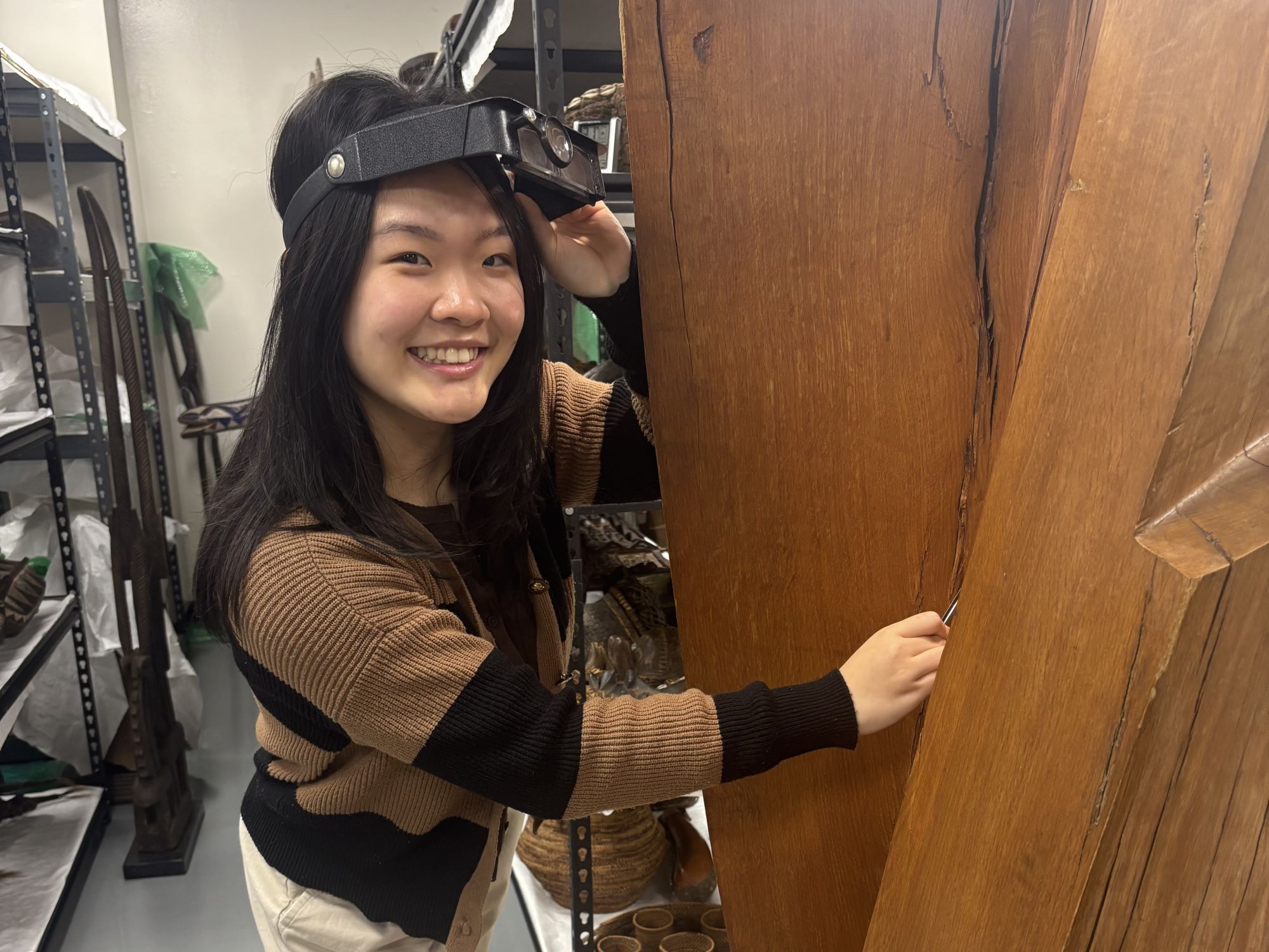 Rachel Chen examines Piccolo sculpture at UTA Fine Arts Collection Thumbnail