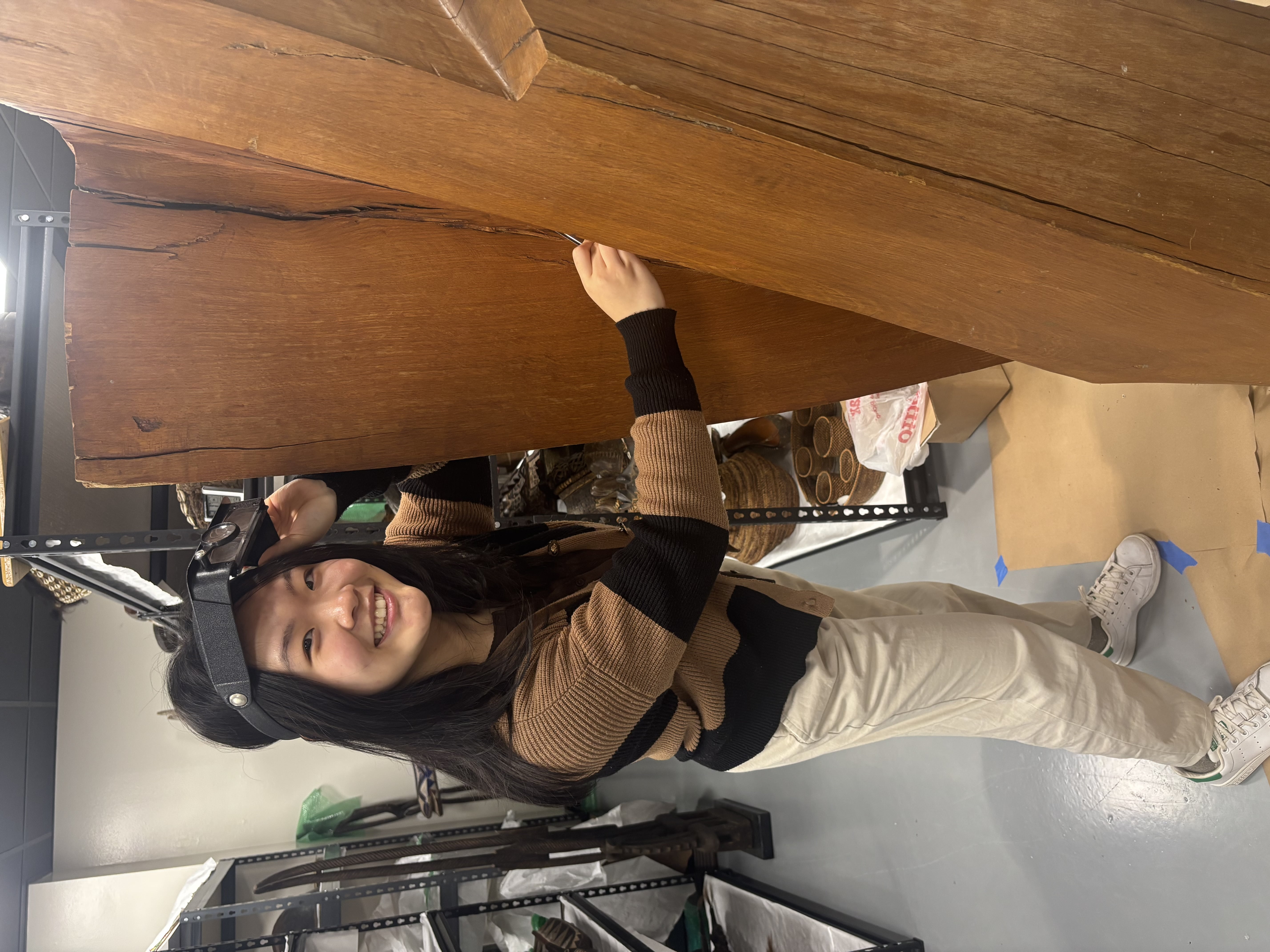 Rachel Chen examines Piccolo sculpture at UTA fine arts collection