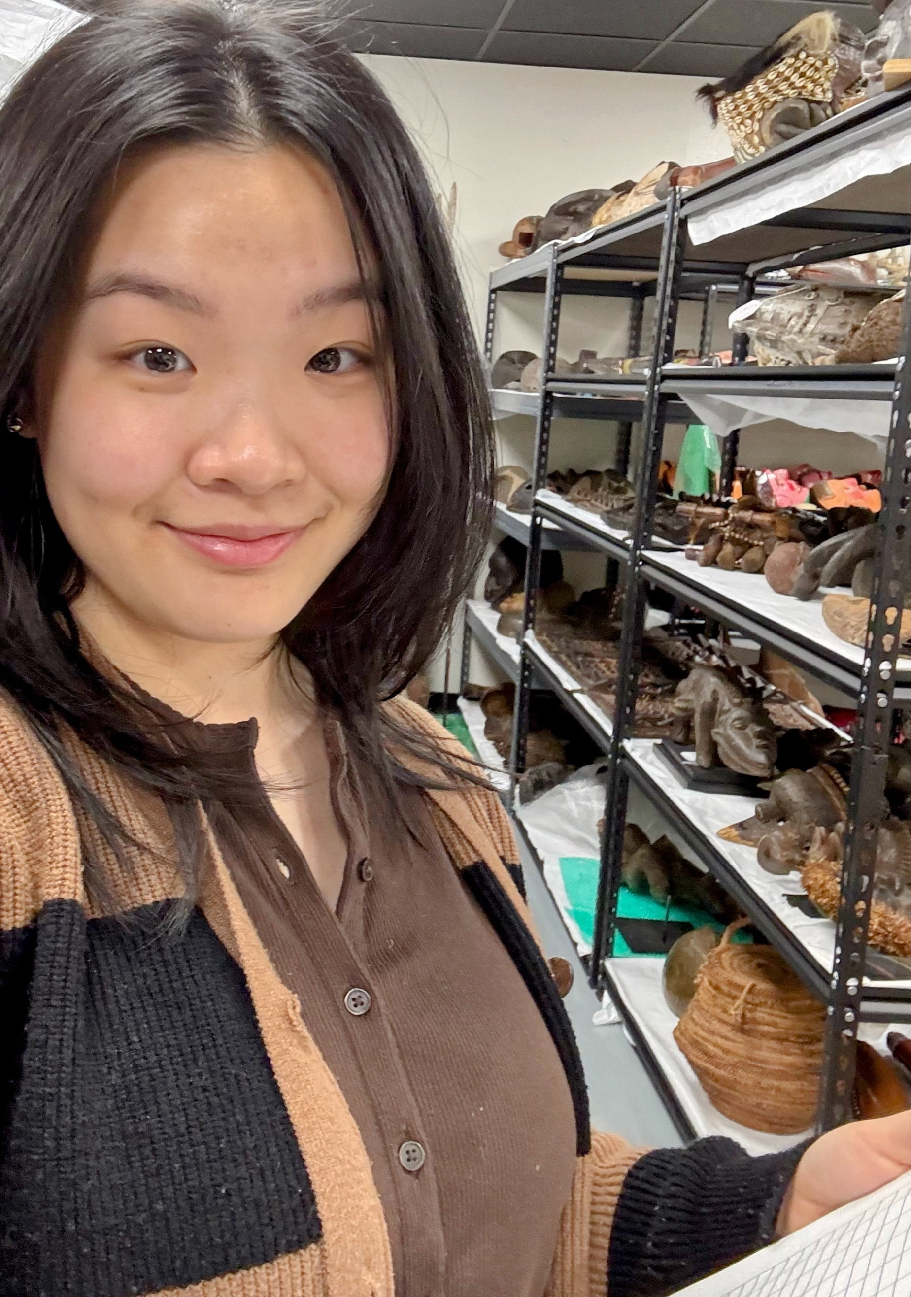 Rachel Chen working with objects at UTA fine arts collection room