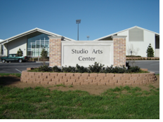 the front of the studio arts center at UTA