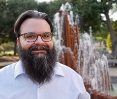 Photo of Teneyck in front of fountain