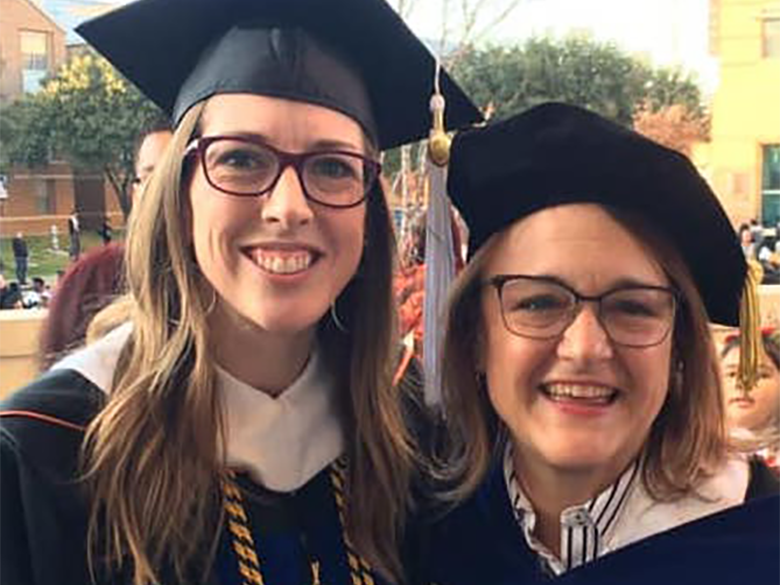 Professor with student at graduation
