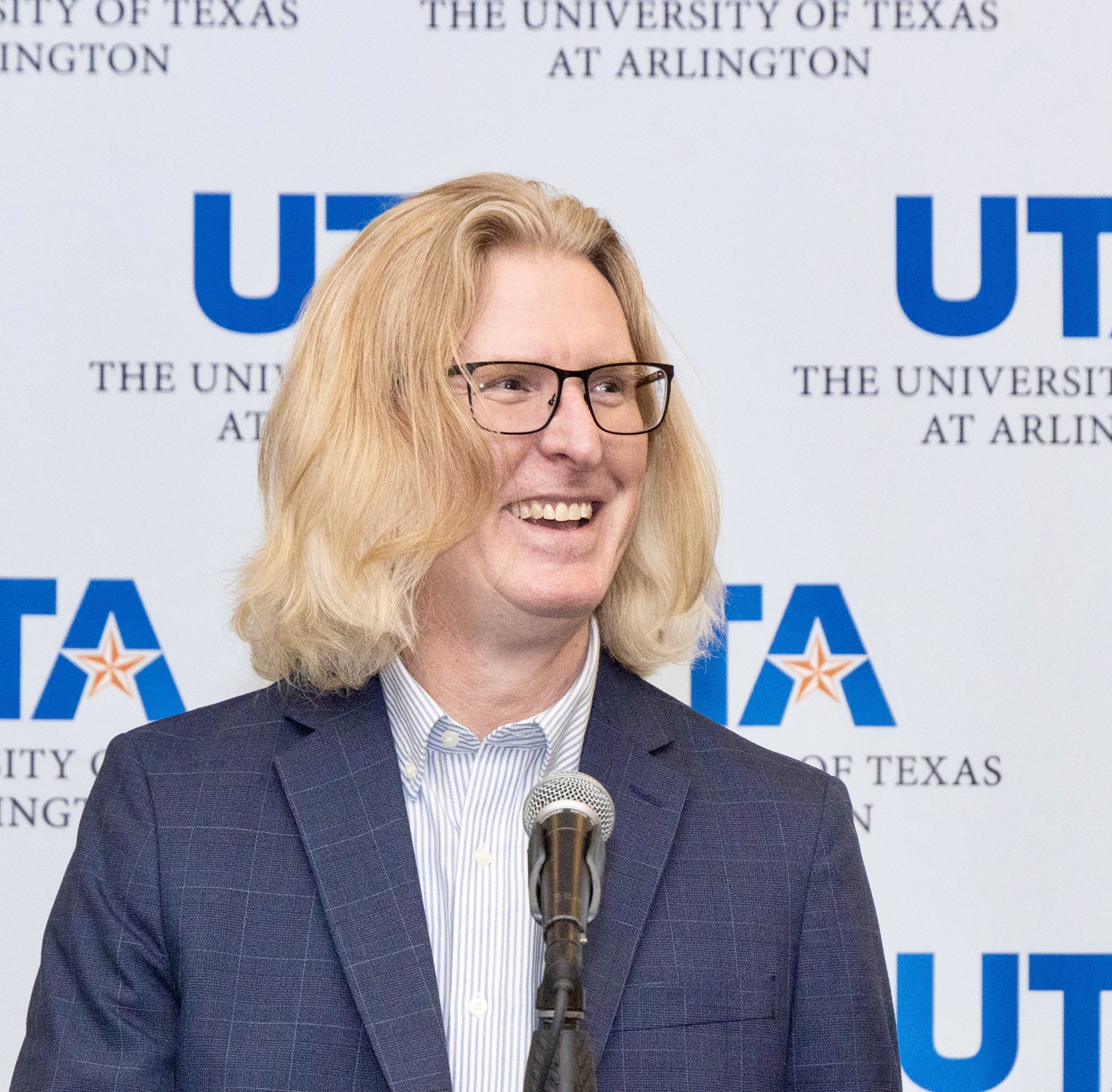 Andrew Milson Smiling a bright photogenic smile