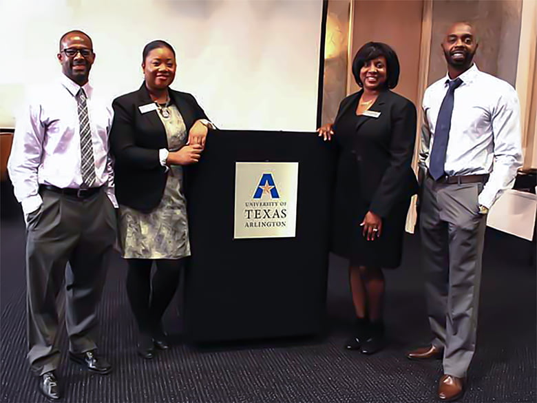 Center for African American Studies team members posing by a podium