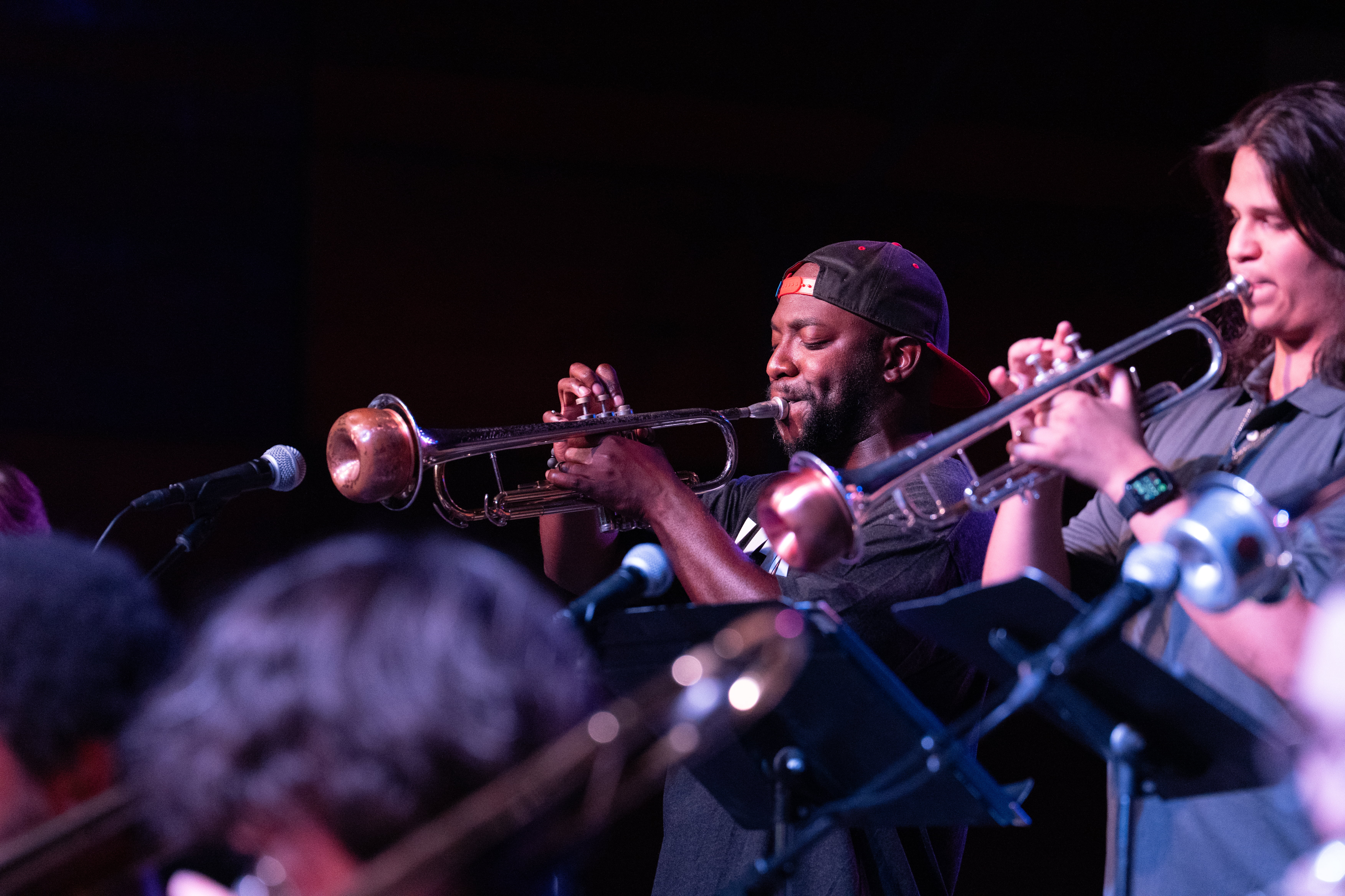 Gabriel playing the trumpet on stage.