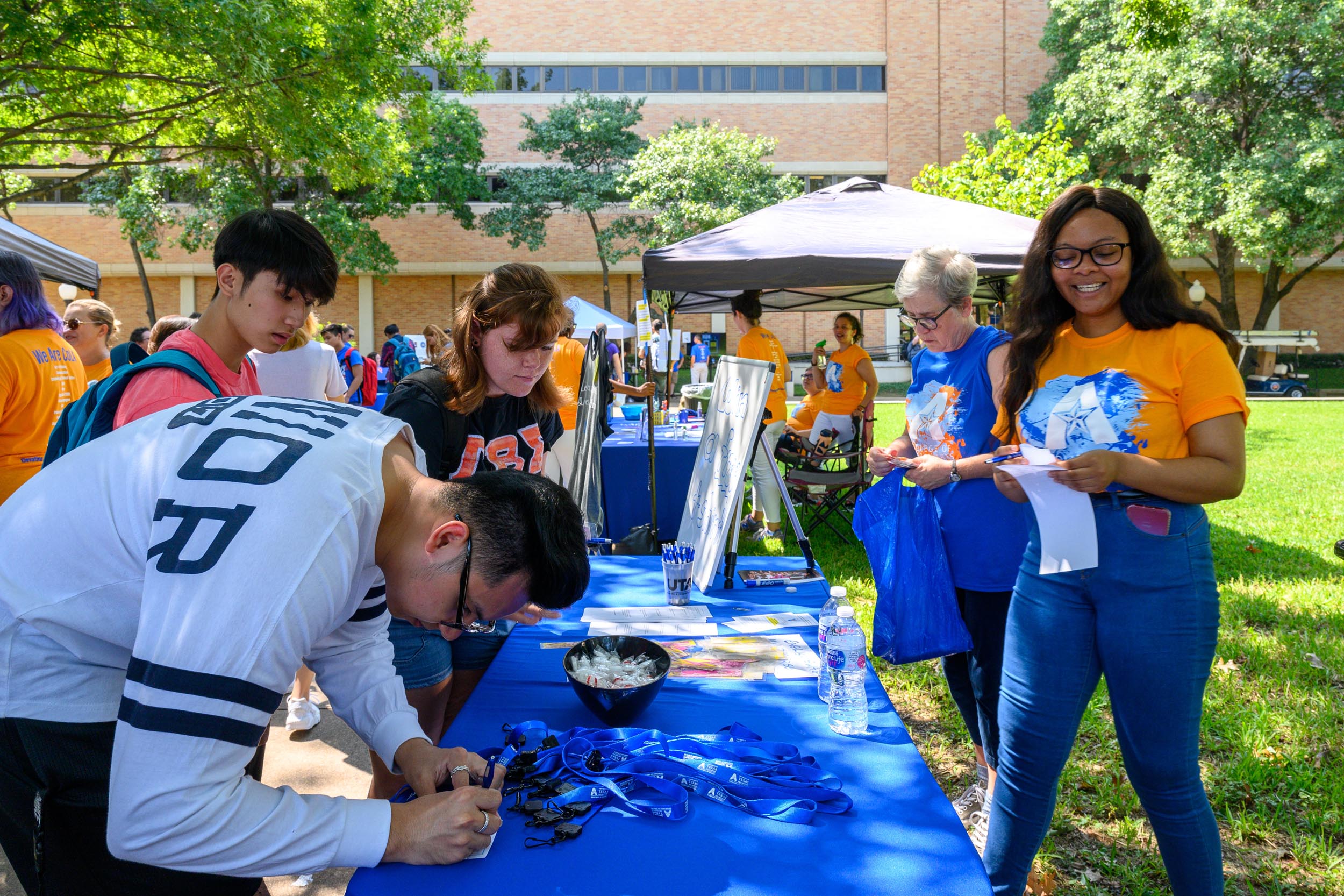 student visiting booths at a campus event