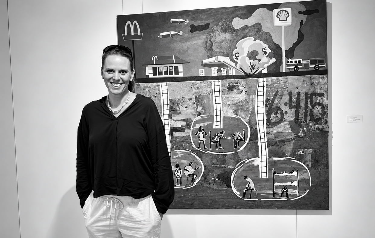 Emelie Stenhammar standing in front of one of her artworks.
