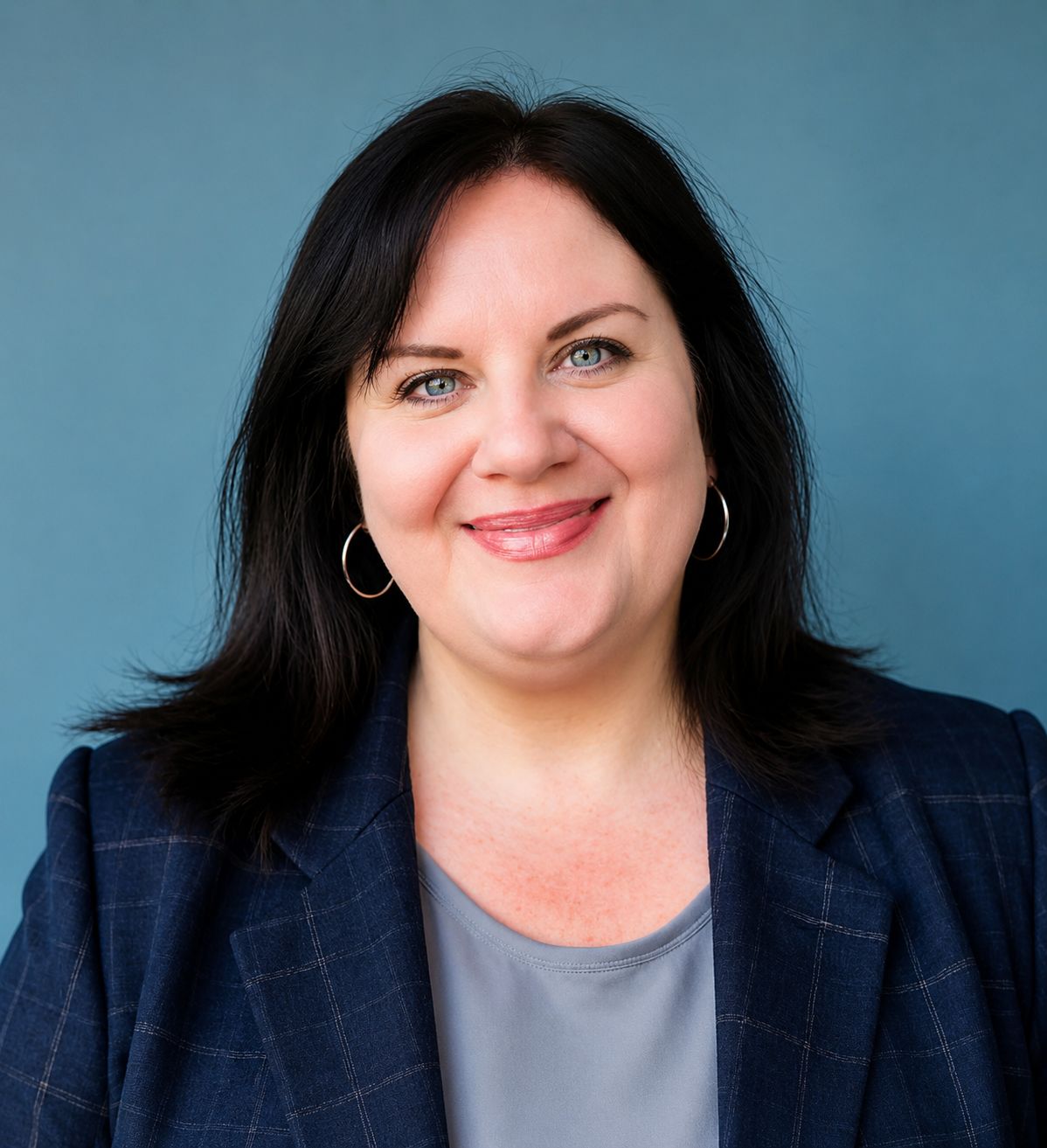 Jennifer LaPrade in a suit, smiling.