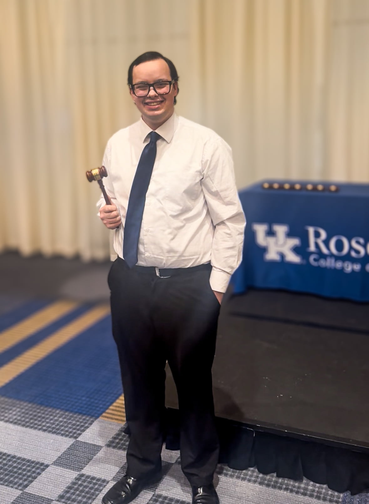 Timothy Flach posing with a gavel.