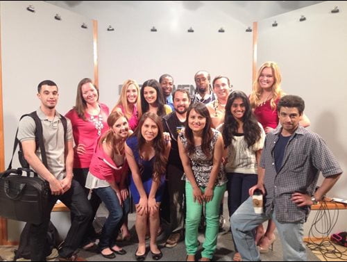 Omar and friends standing besides each other, some are squatting lower