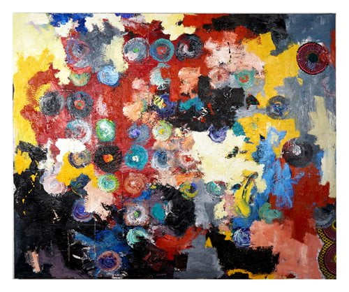 Close up of a painting that has various colors as the background and several colored circles