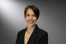 Barbara Berthold headshot. She has short hair and is wearing a suit.