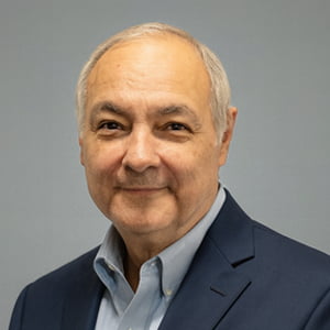 Marvin Diaz smiling wearing a suit.