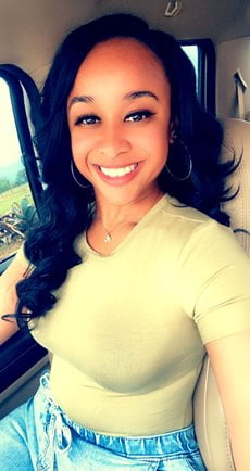 Sensiria Green smiling with long hair
