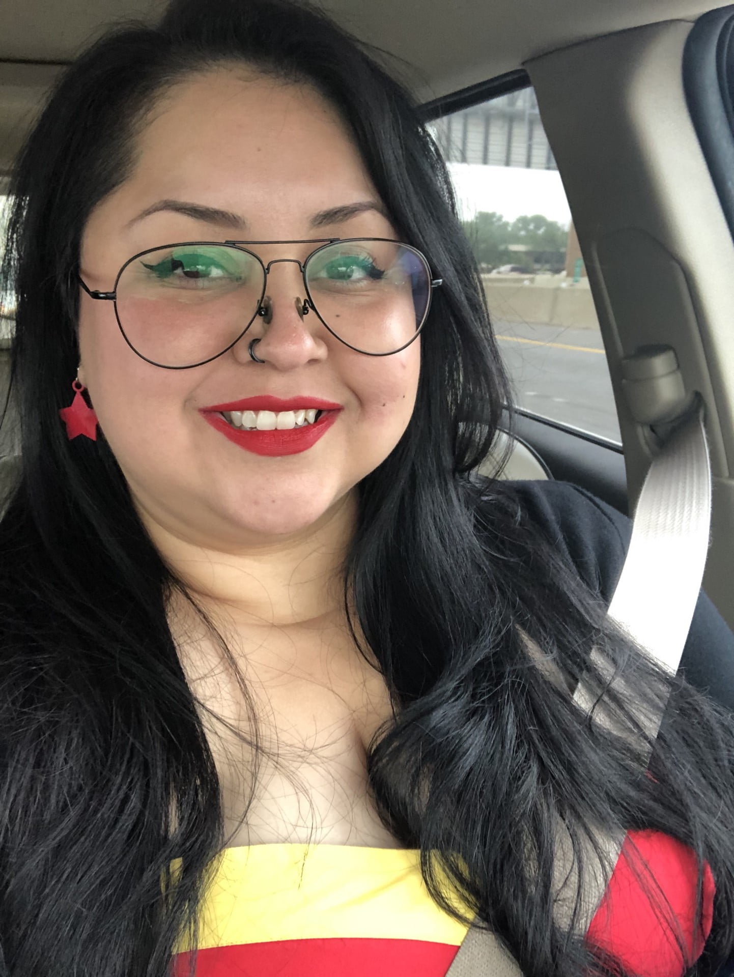 Ana Mariscal inside her car taking a picture of herself