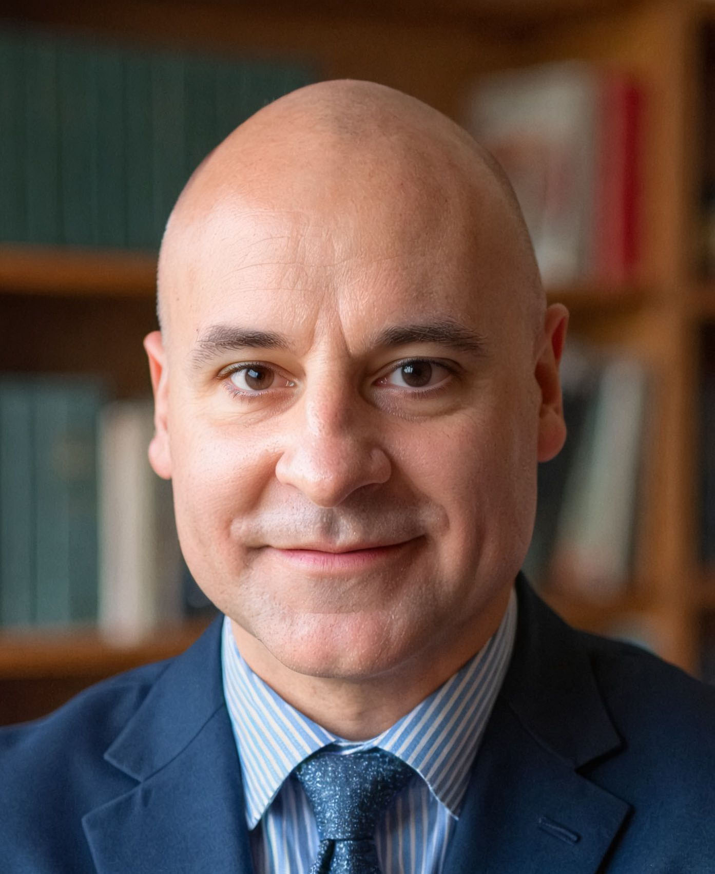 Headshot of Sebastian Traitor wearing blue suit and tie