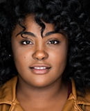 Headshot of Johnique Mitchell smiling gently