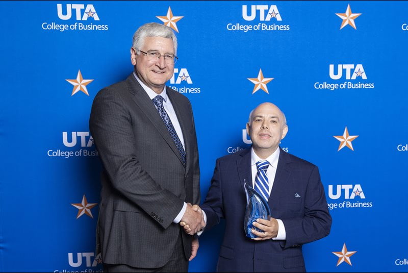 Greg Frazier shakes the hand of Richard Ashton, President of AMD Development, LLC.